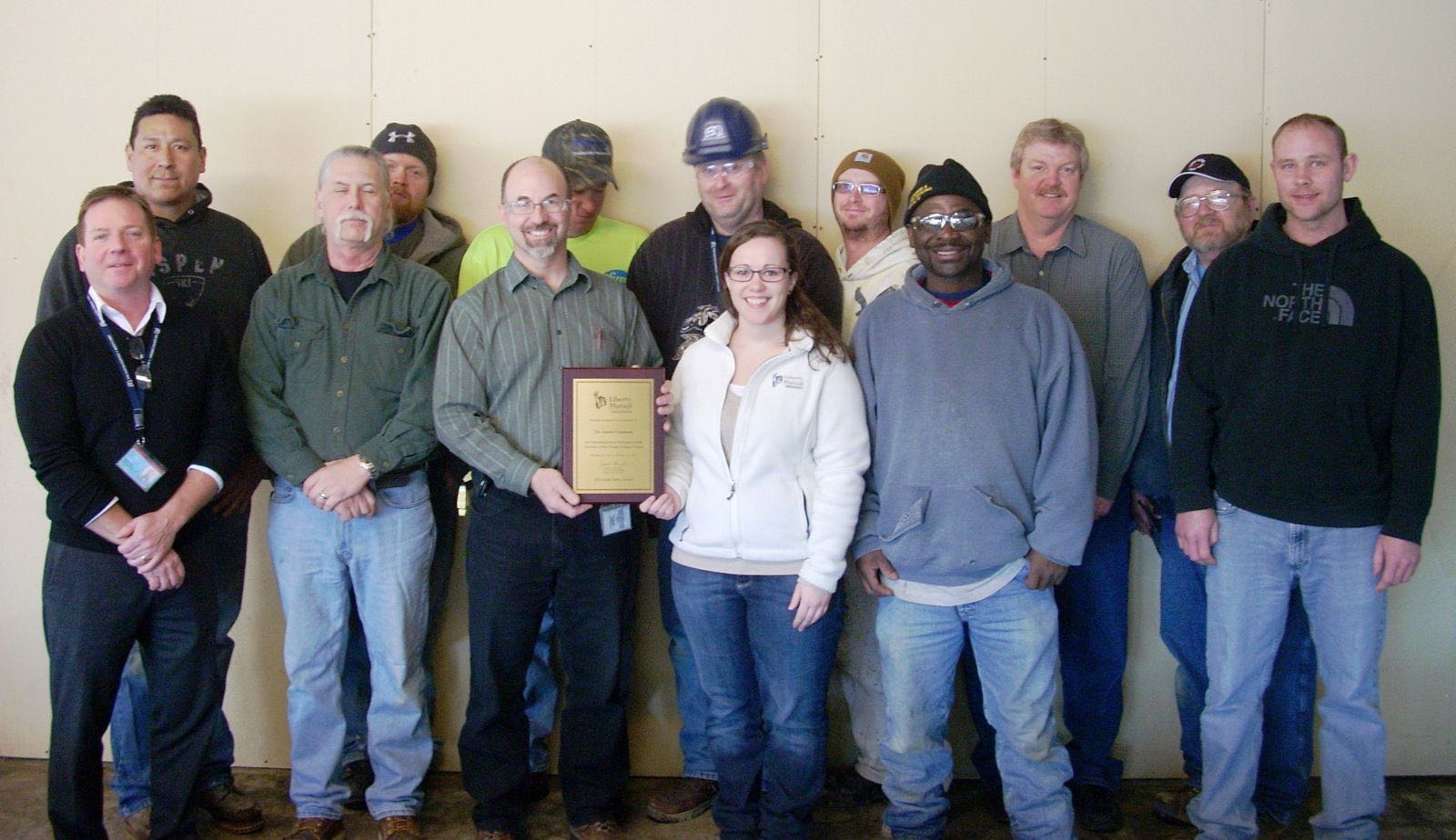 the austin team holding the liberty mutual gold safety award