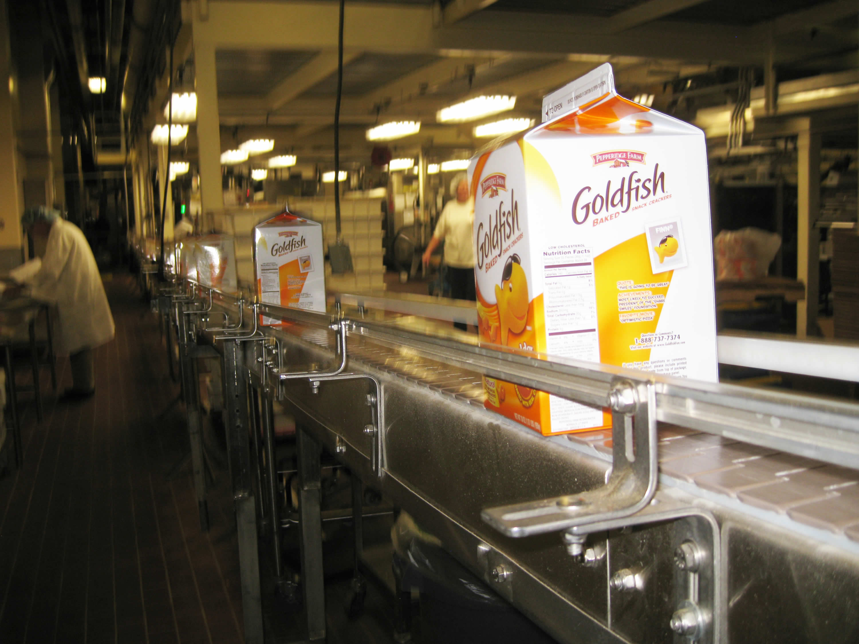 Large packages of Goldfish crackers on a production line