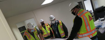Construction safety team looking at plans