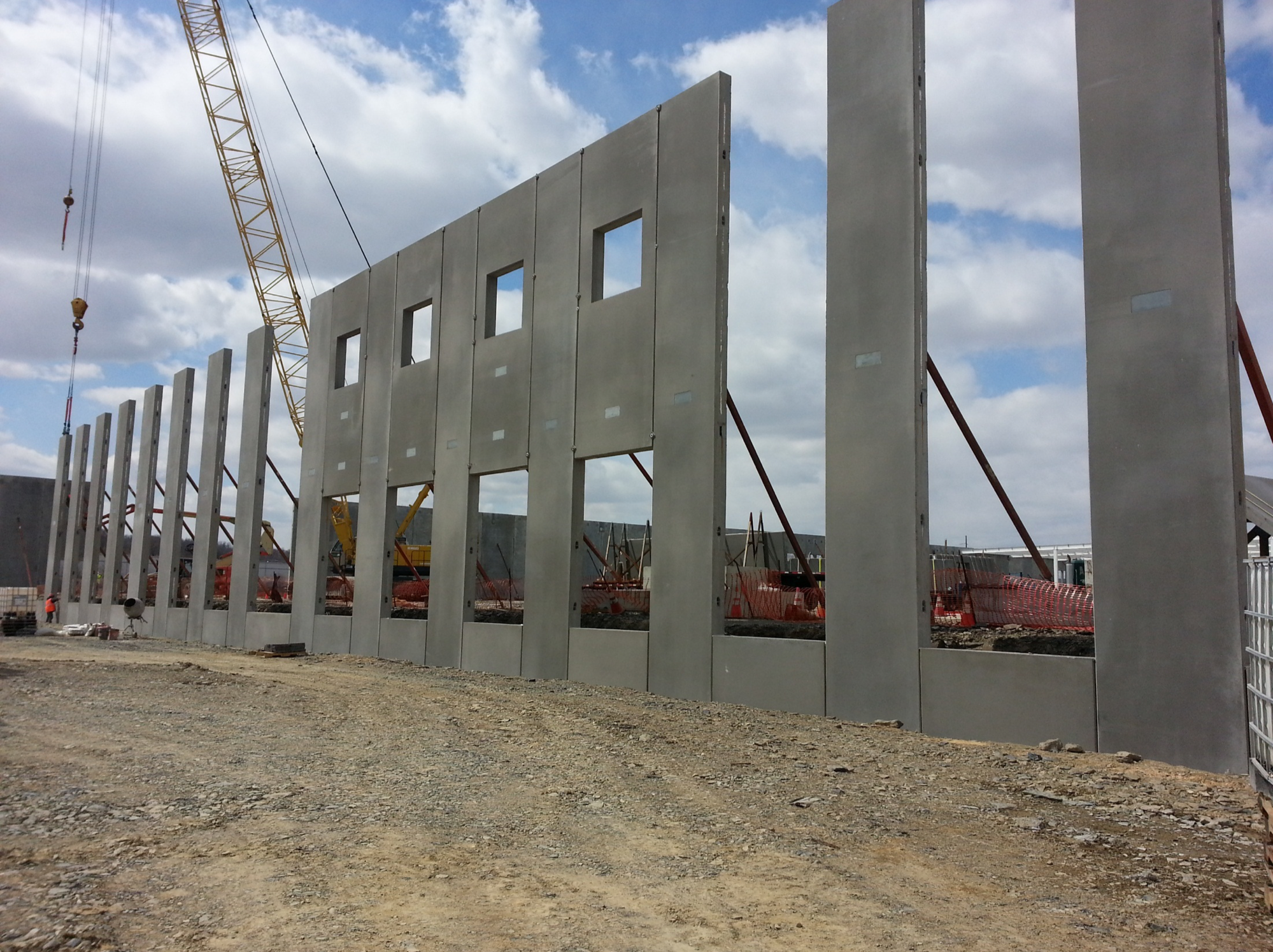 Concrete tilt-up panels on active construction site.