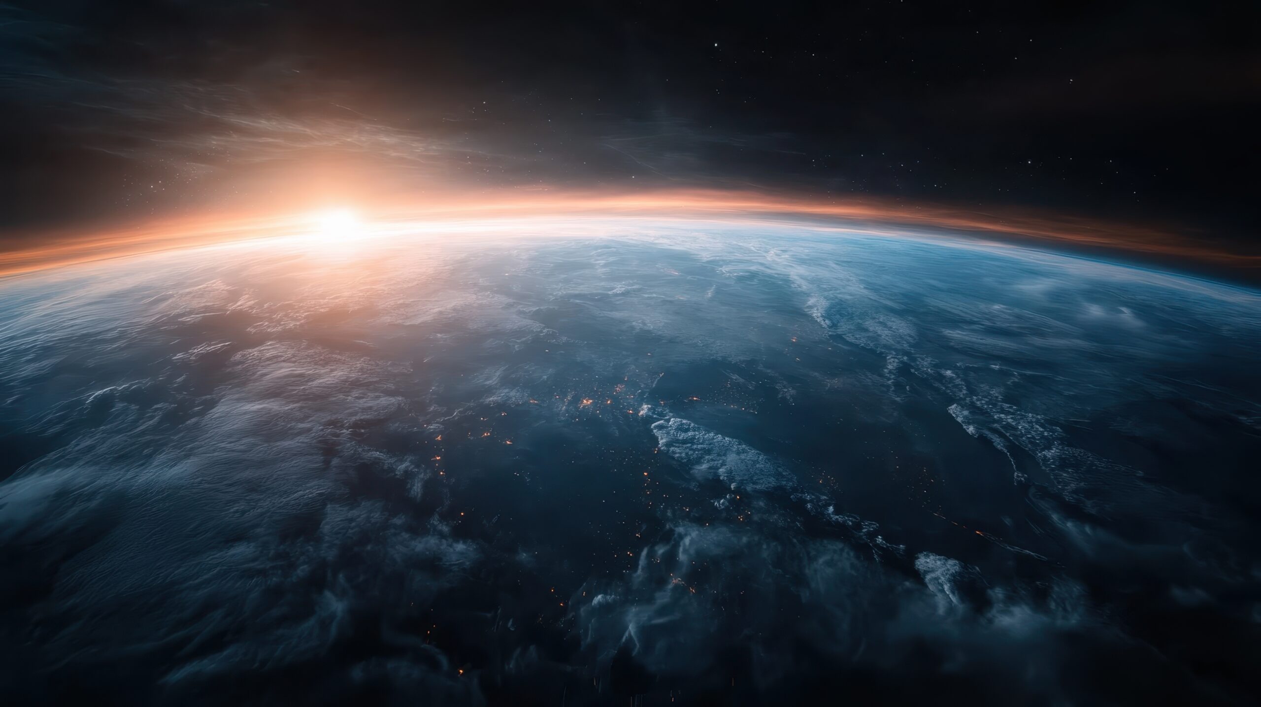 An awe-inspiring image showing the curvature of Earth as seen from space during sunrise, with the glowing horizon and twinkling city lights against a dark backdrop.